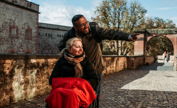 Man pushes his wife in a wheelchair through Ehrenbreitstein Fortress © ©Janko.Media